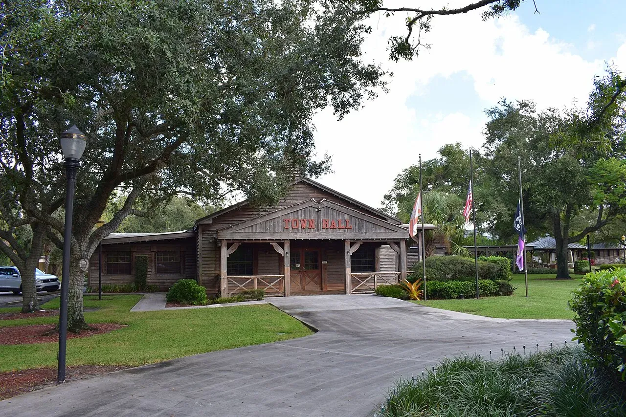 Davie's western-style wooden Town Hall under oaks, Davie
