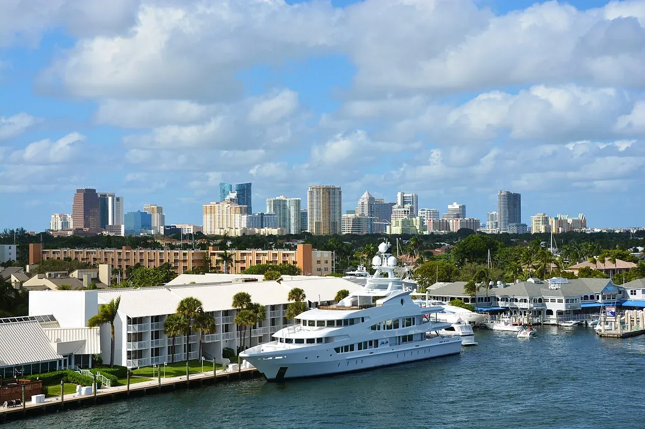 Downtown skyline behind waterfront marina and yacht, Fort Lauderdale