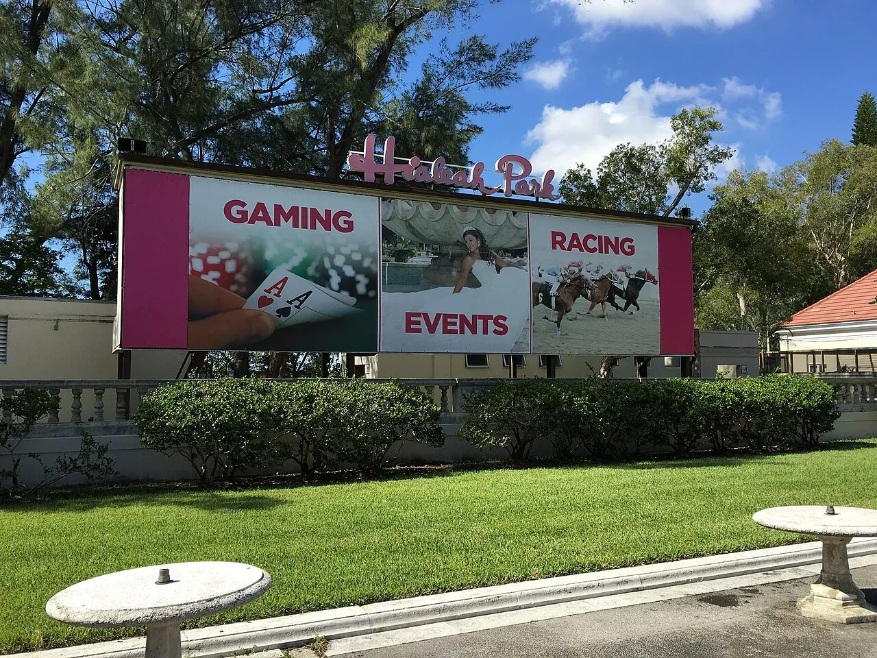Historic Hialeah Park entrance sign with landscaped grounds, Hialeah