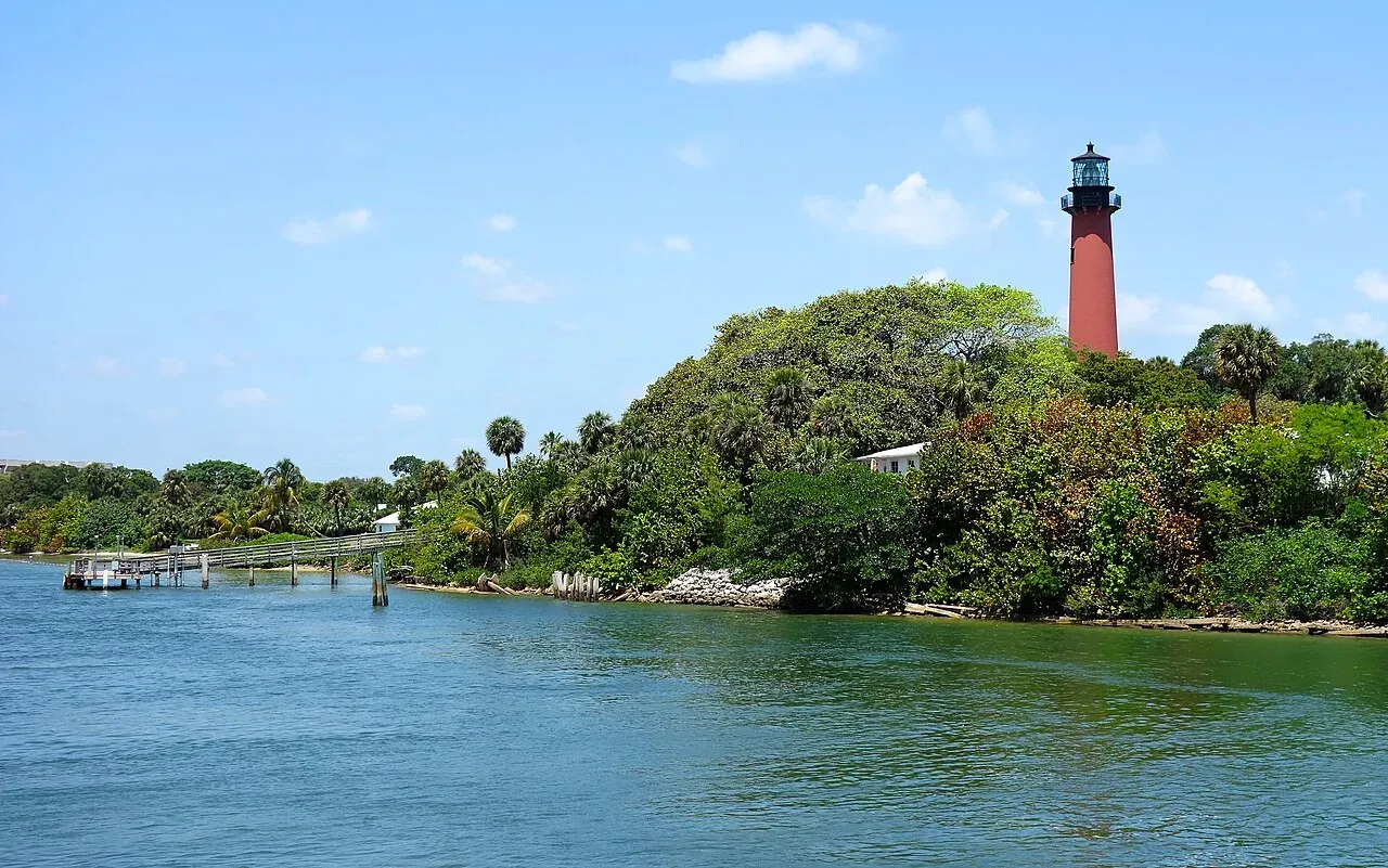 Red Jupiter Inlet Lighthouse above the Loxahatchee River waterfront, Jupiter