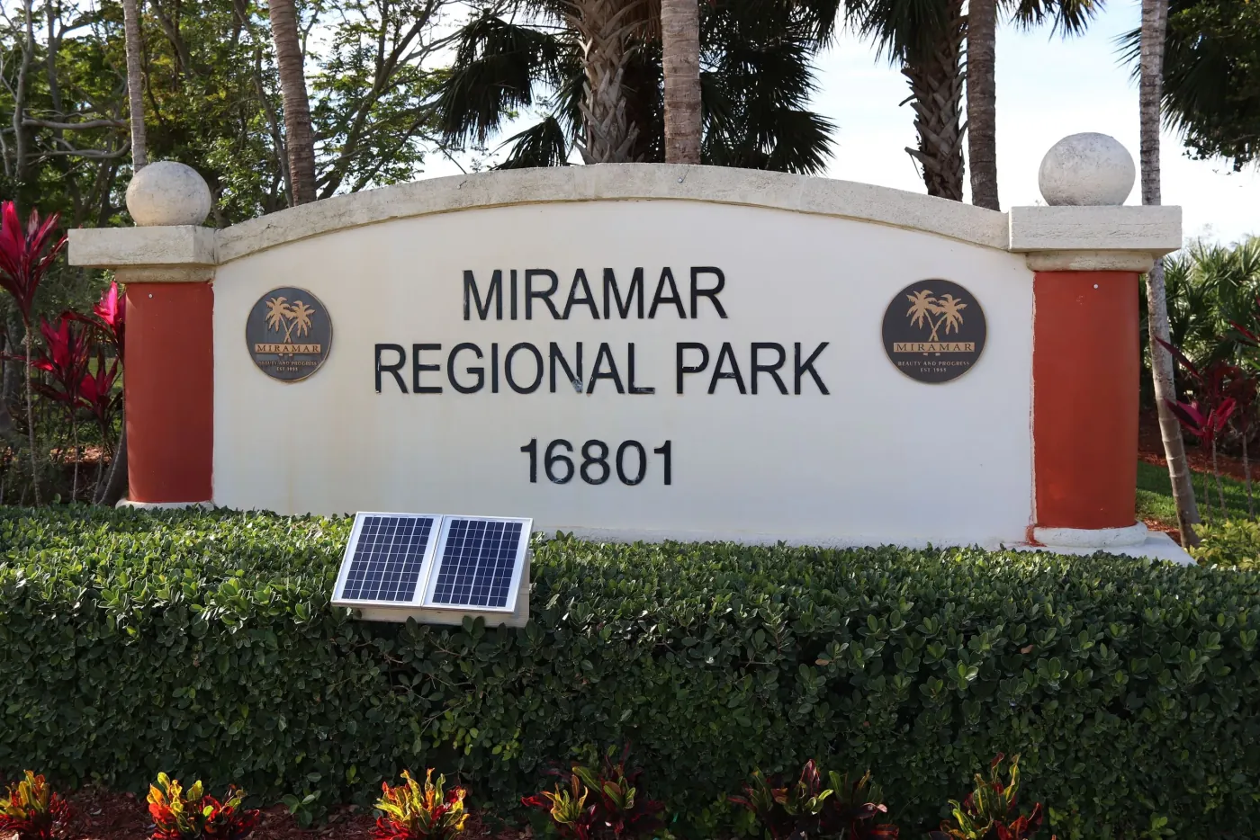 Landscaped entrance sign at Miramar Regional Park in Miramar, Florida