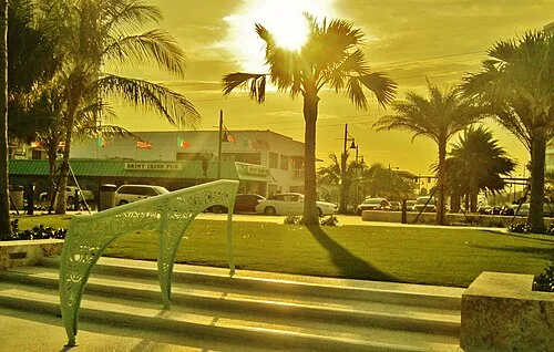 Palm-shaded beachfront playground beside the ocean in Pompano Beach