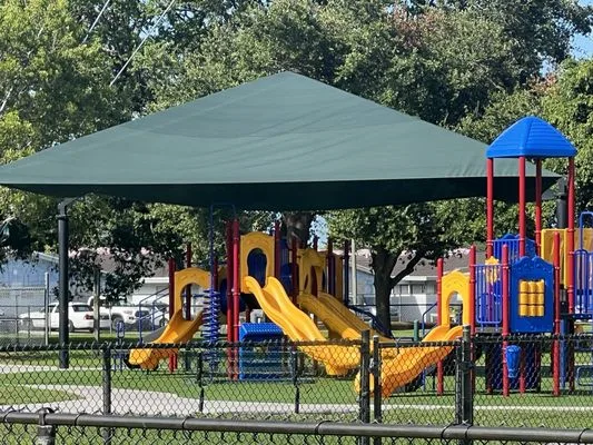 Colorful shaded playground at McTyre Park in West Park, Florida