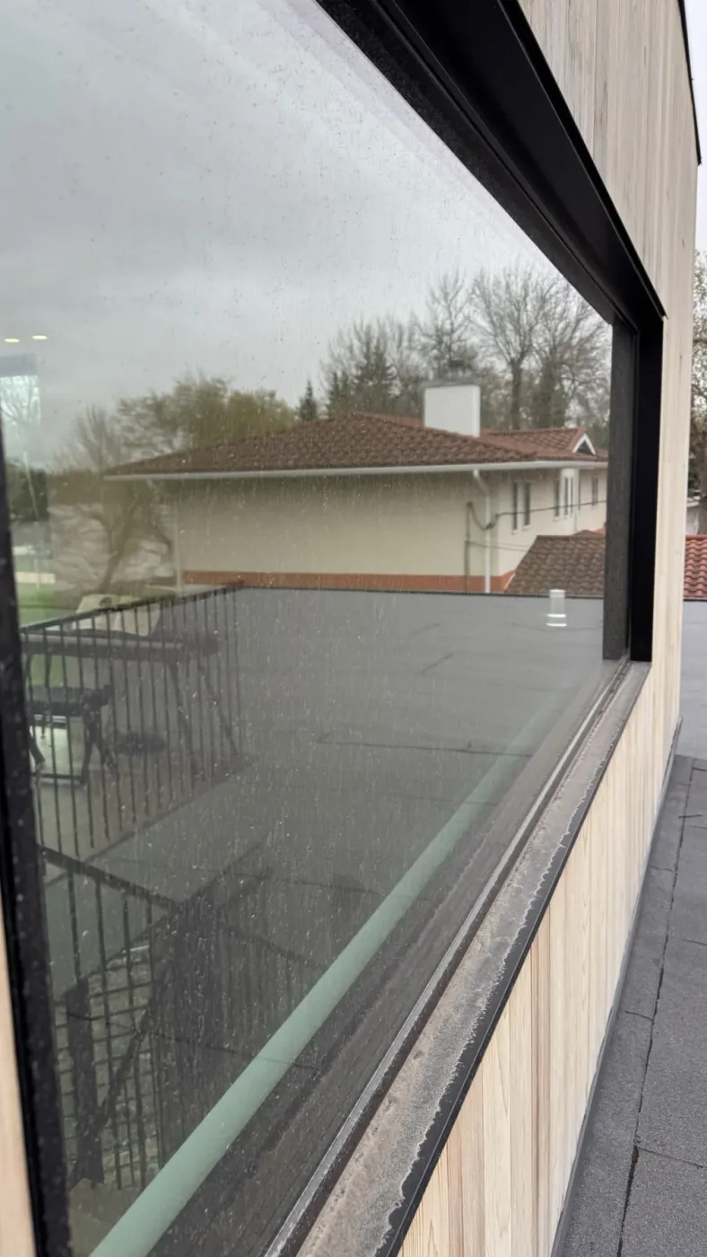Large exterior window and track, before cleaning